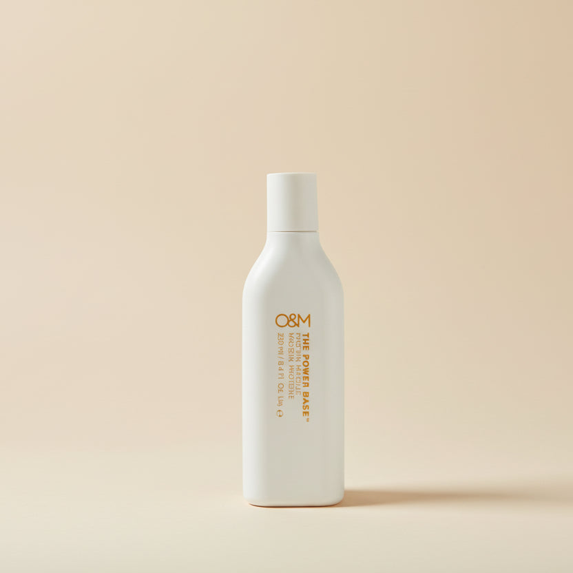 White bottle with 'QSM' branding on a white background