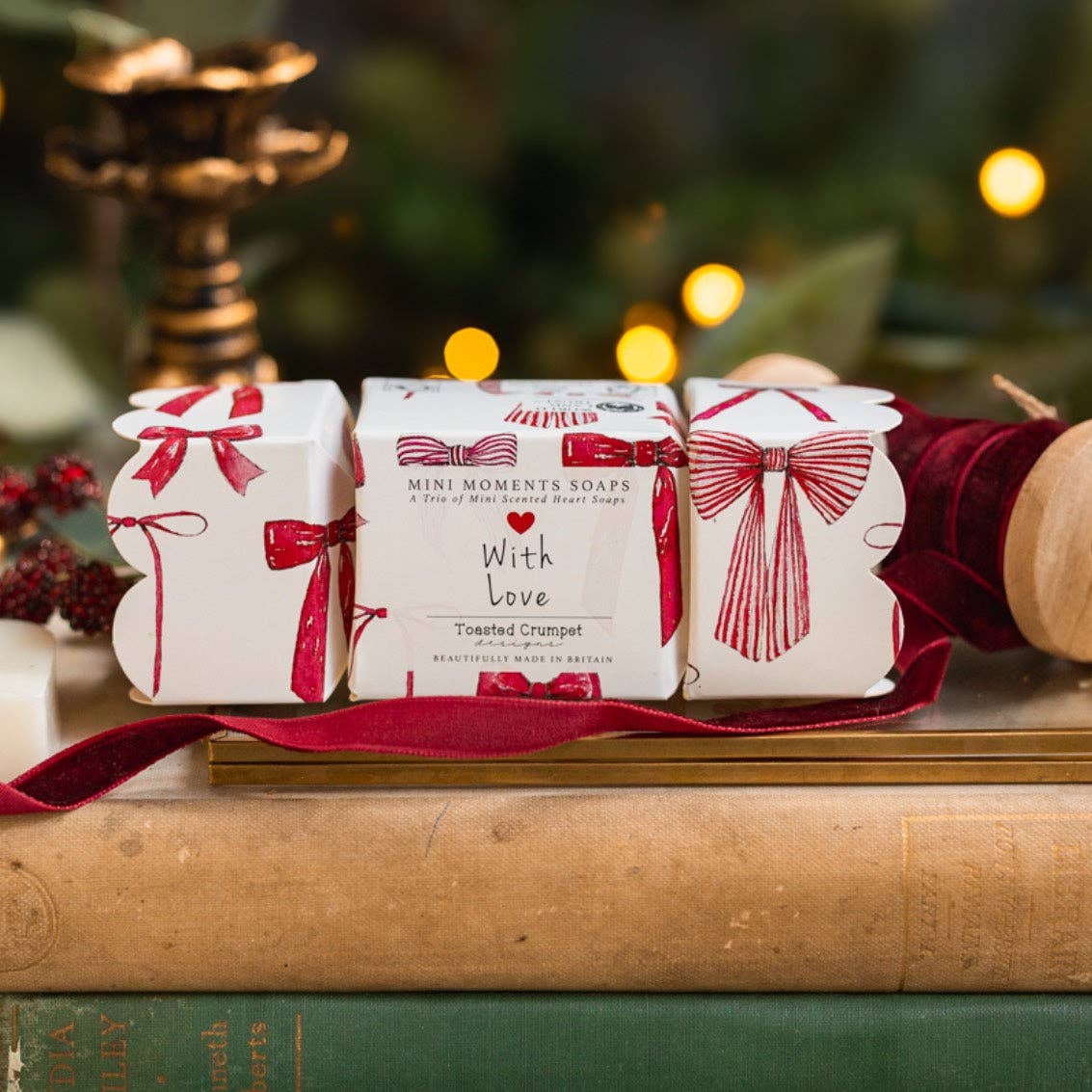 Toasted Crumpet Crimson Velvet boxed mini soaps in a red bow print cracker shaped gift box with heart shaped soaps