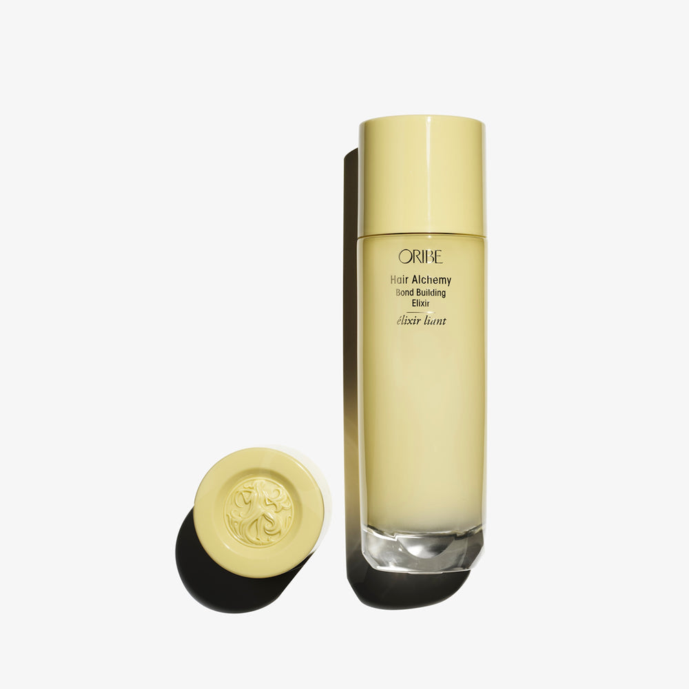 Oribe Hair Alchemy Bond Building Elixir 100ml glass bottle packshot, leave-in bond repair serum for fragile hair
