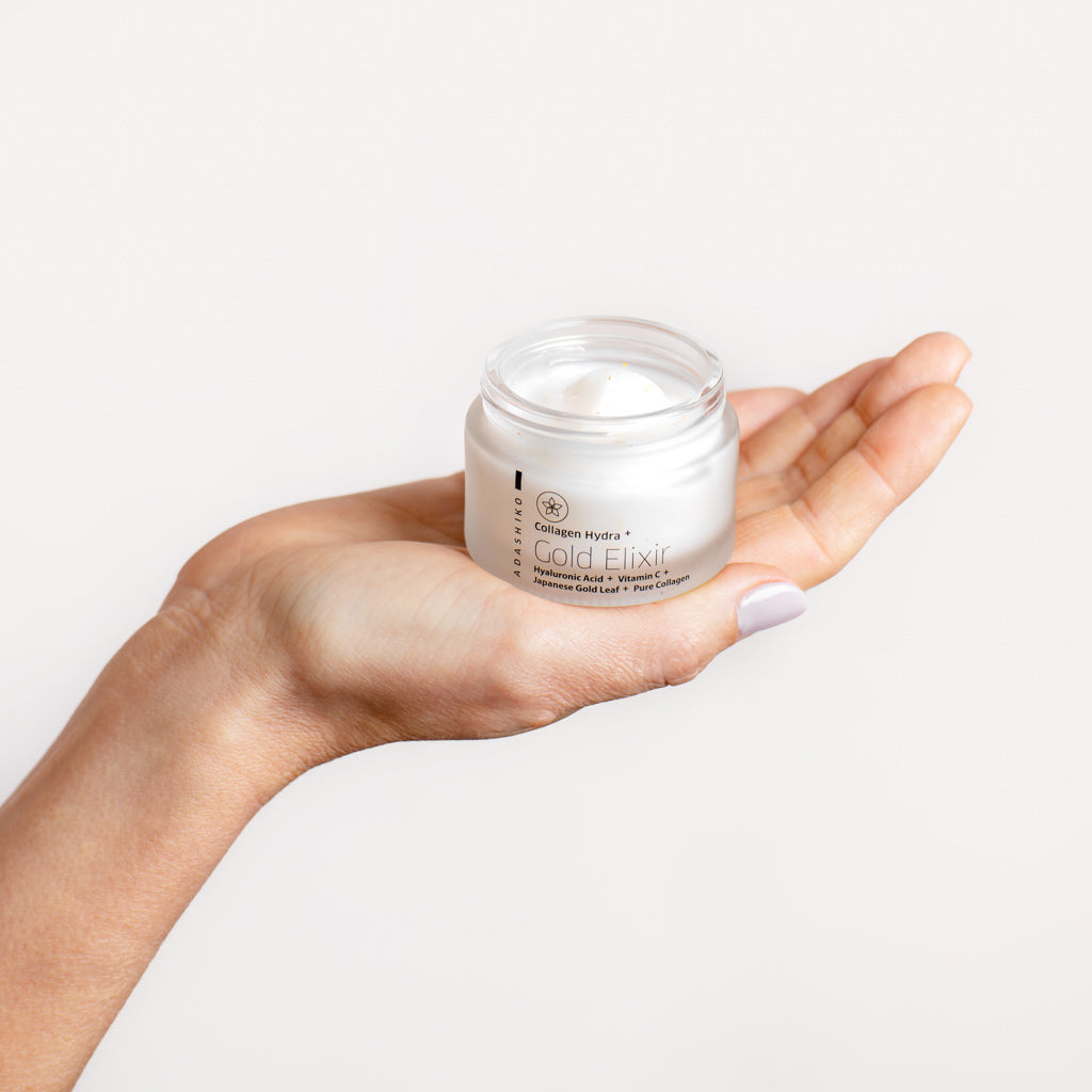 Adashiko Collagen Hydra Gold Elixir 50ml jar held in hand
