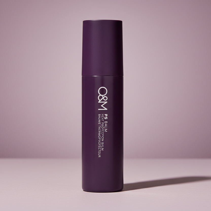 Purple hair balm tube with 'O&M' branding on a white background