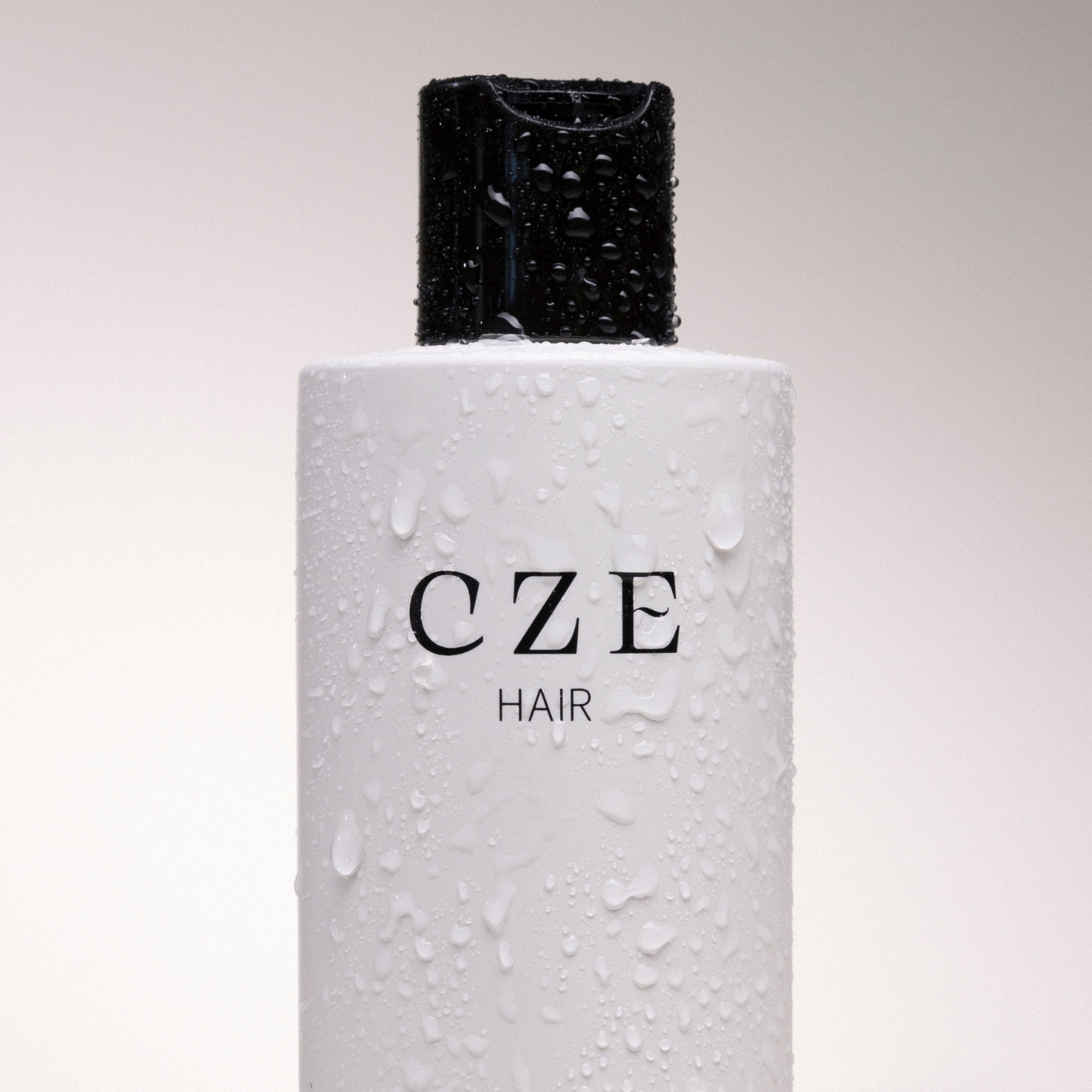 CZE Hair Silk Wash bottle with water droplets hydrating shampoo detail