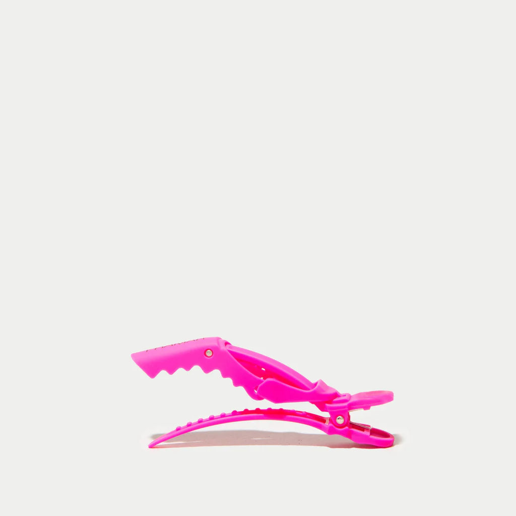 Pink hair clip on a white background
