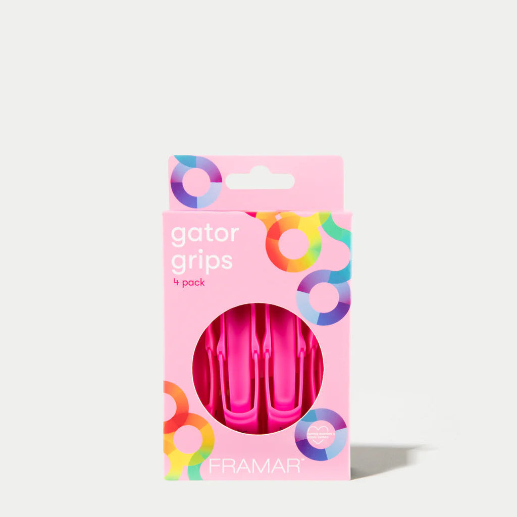 Pack of pink gator grips with colorful packaging on a white background