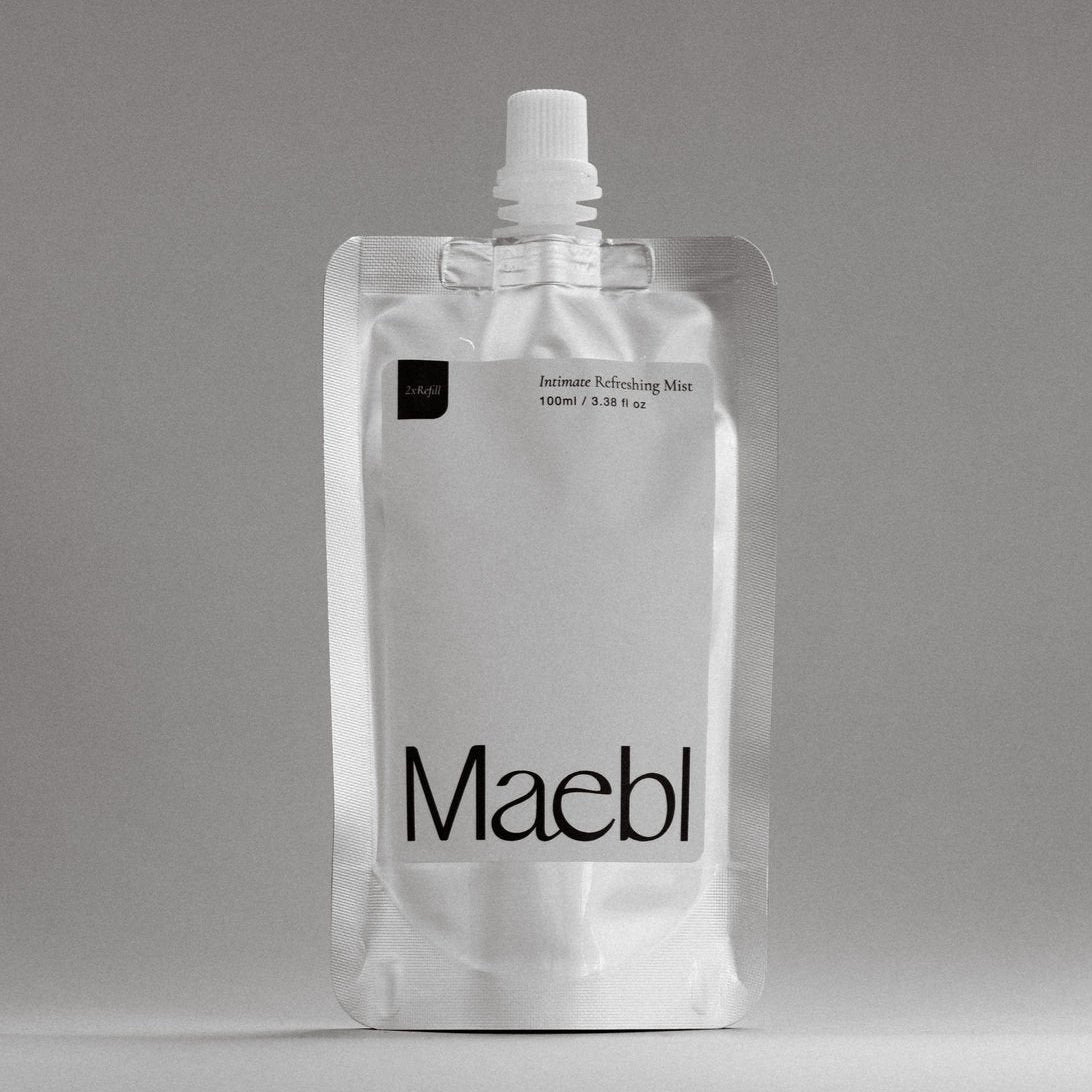 Refill packaging of 'Maebl' Intimate Refreshing Mist on a gray background