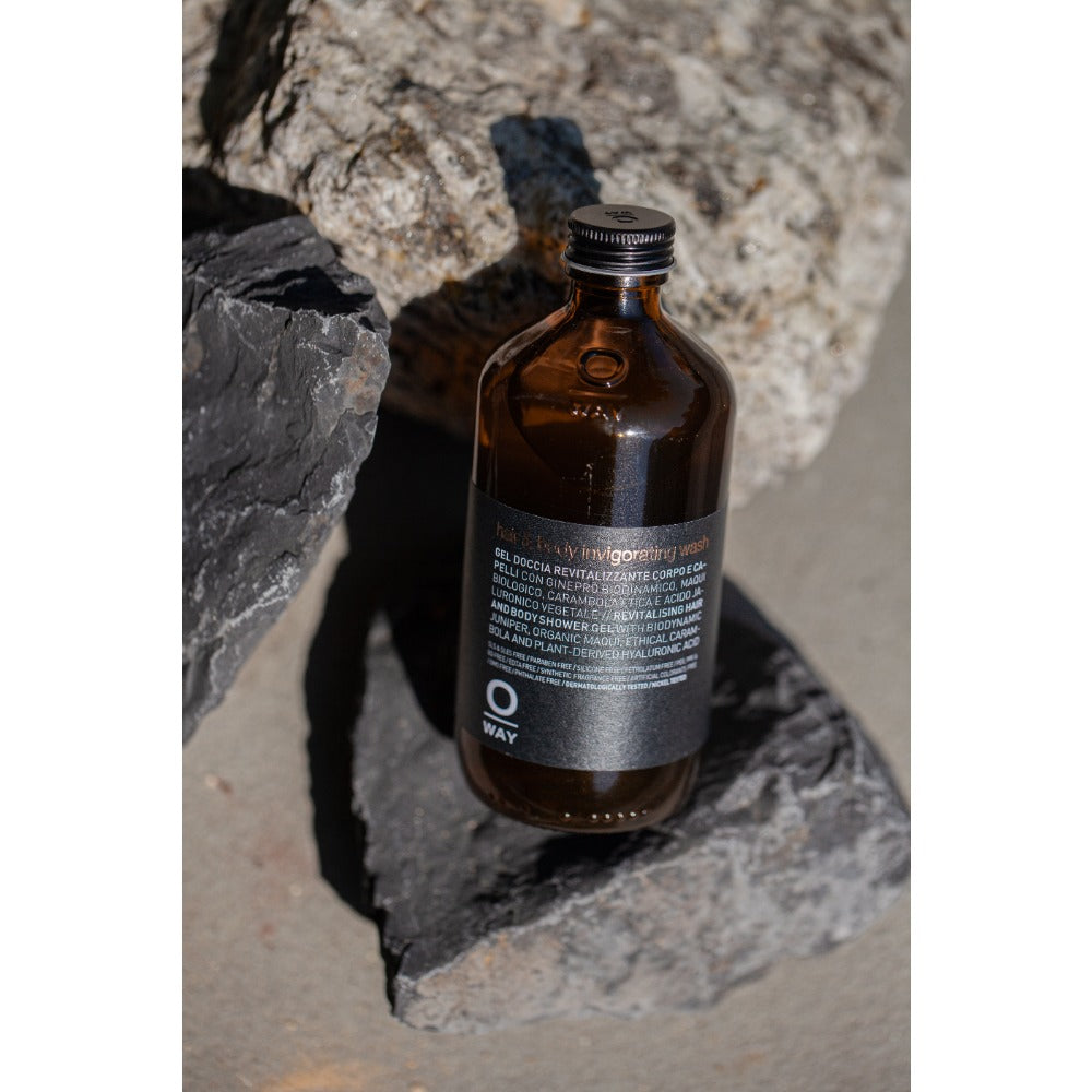 Oway Hair and Body Invigorating Bath bottle on stone