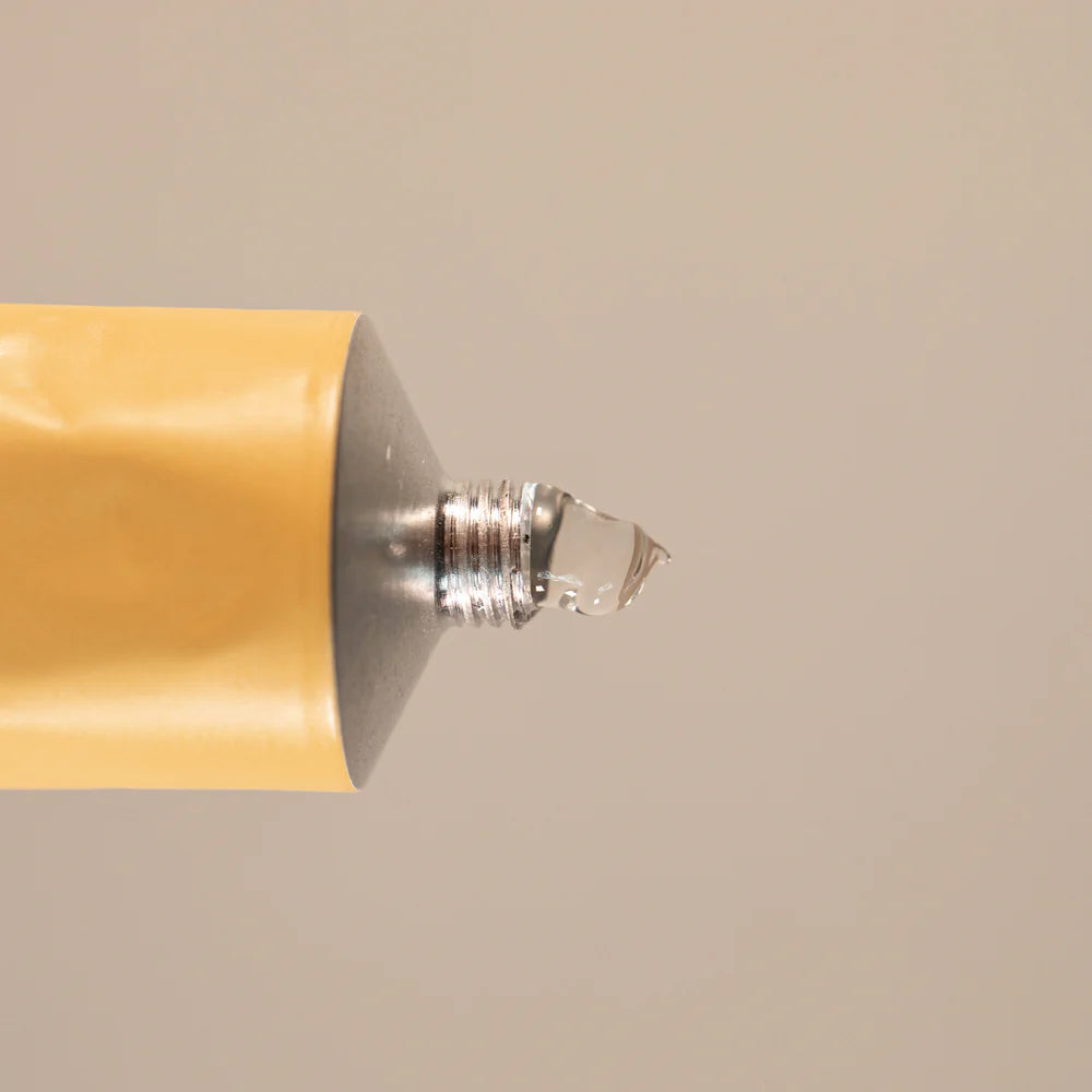 Close-up Oway Glimmering bond gel with a beige base on a beige background