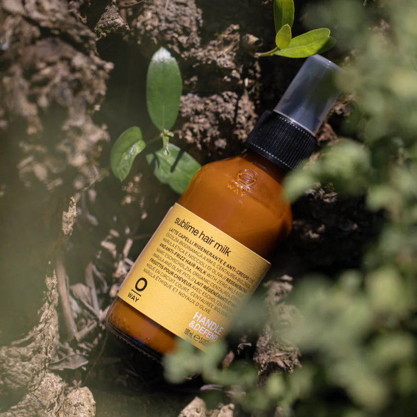 Bottle of Oway Sublime hair milk on a natural background
