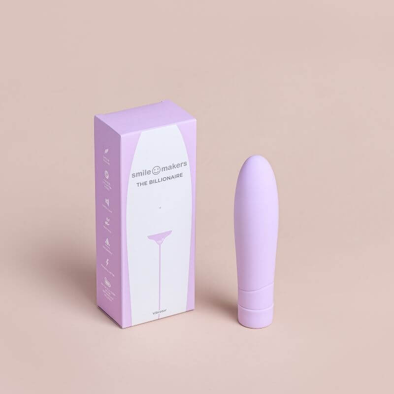 The Billionaire Vibrator brought to you by Smile Makers. Picture shows the vibrator standing next to the box.