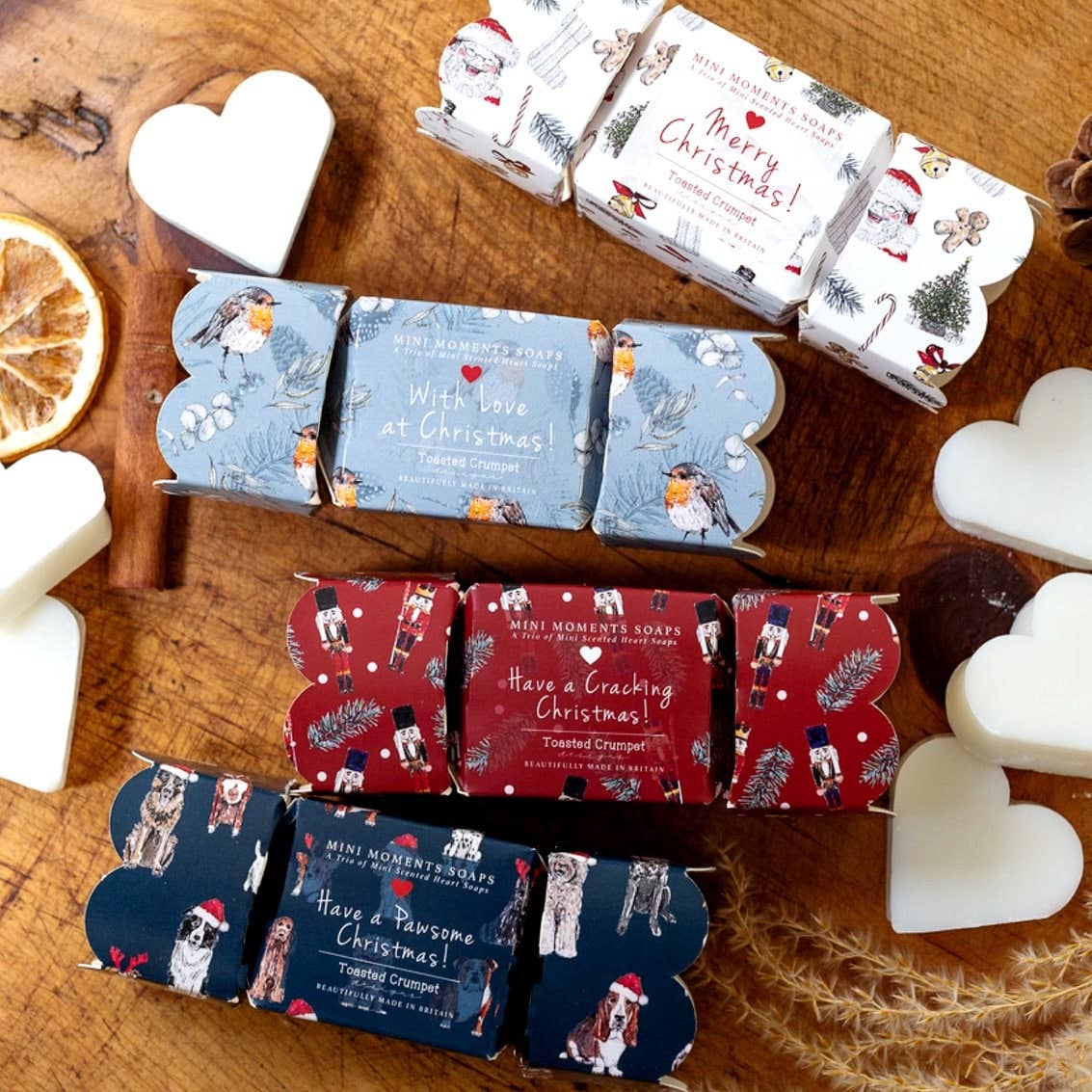 Toasted Crumpet Christmas cracker mini soap gift boxes including the Nutcracker design in red, navy and blue