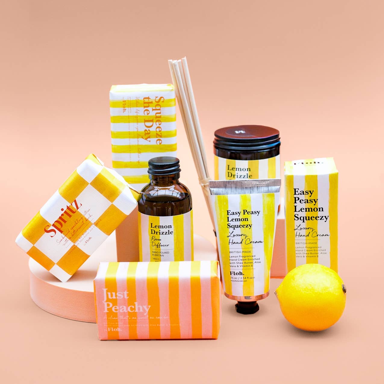Toasted Crumpet Squeeze the Day soap bar shown with the wider citrus range on a peach background