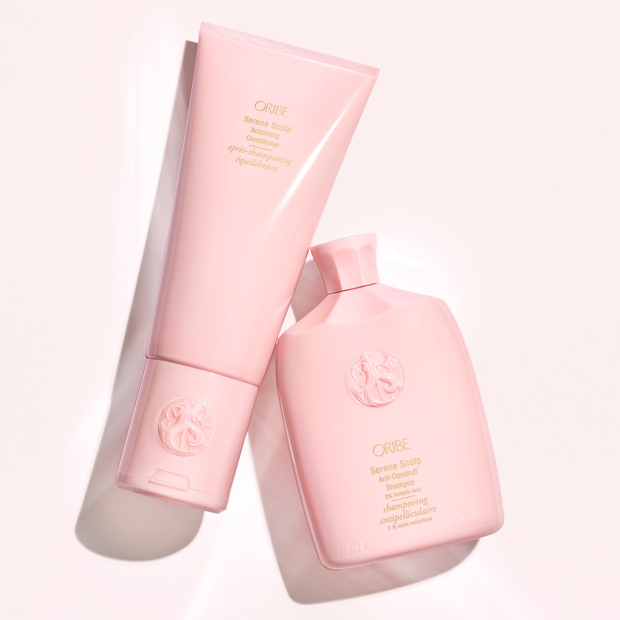 Oribe Serene Scalp Balancing Shampoo and Conditioner duo in pink bottles