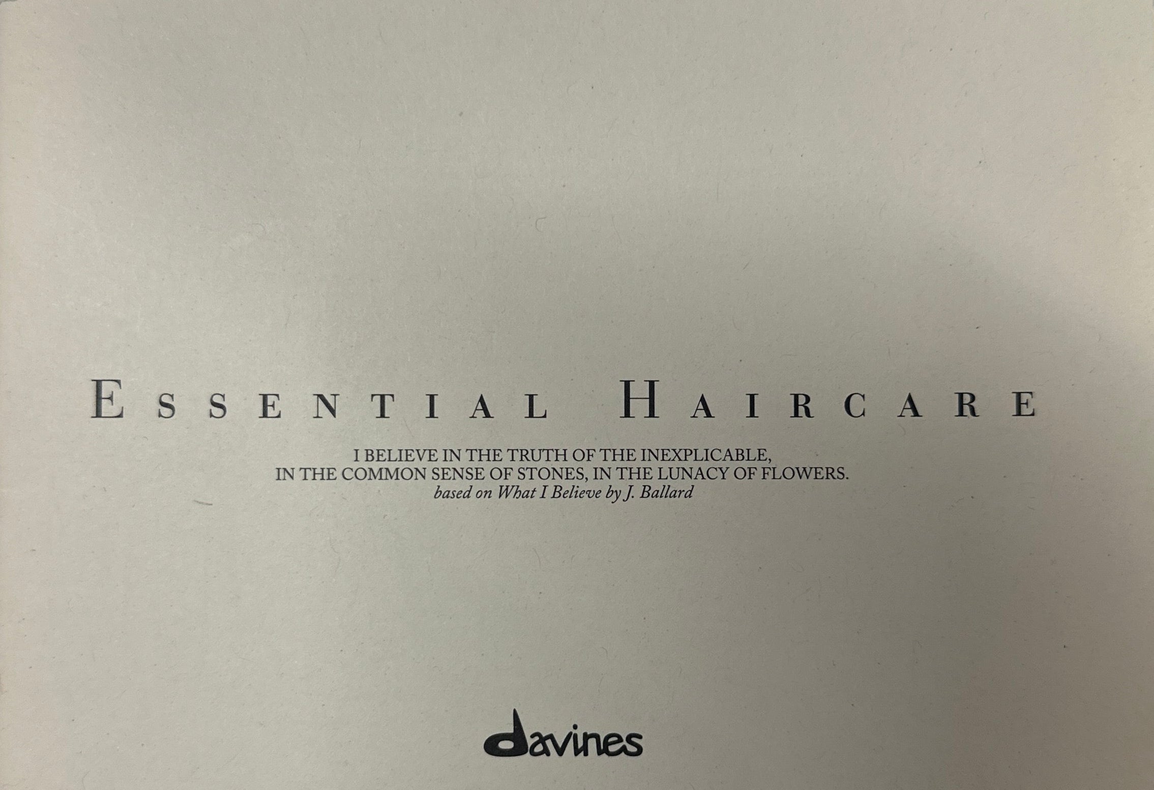 Product packaging for 'Essential Haircare' by davines on a light gray background