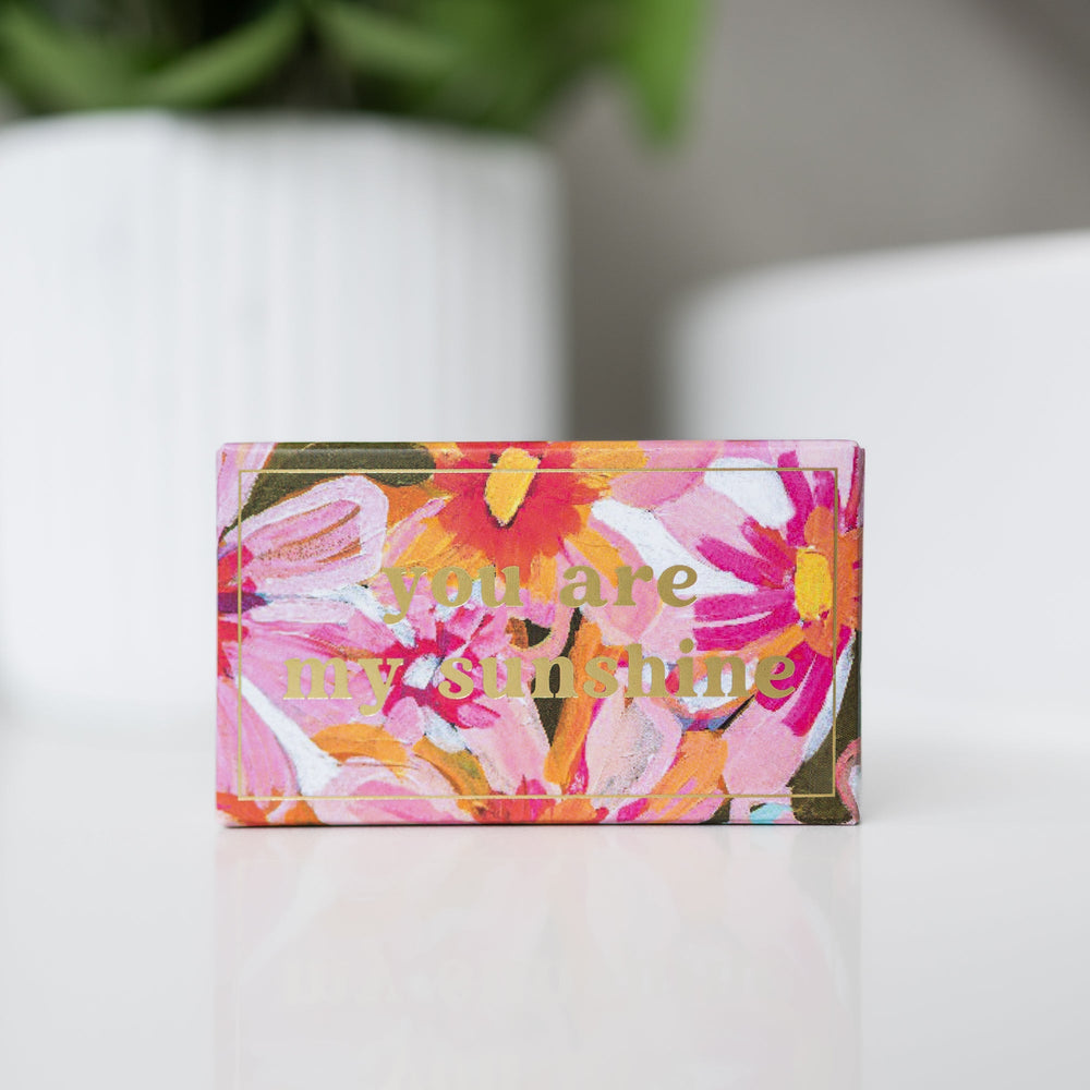 Wild Emery You Are My Sunshine Shower Steamer by Morgan Jamieson, close view of steamer and packaging
