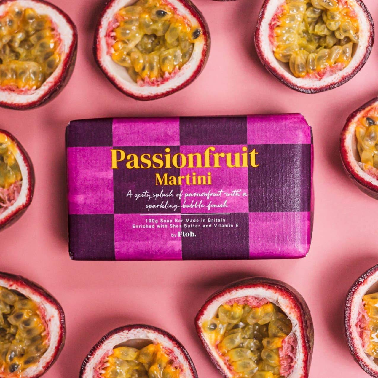 Toasted Crumpet Passionfruit Martini 190g soap bar in purple check wrap on halved passionfruit