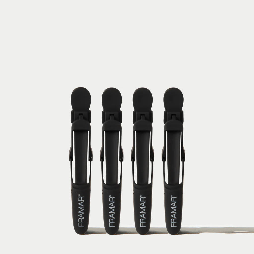 Four black Framar crocodile clips on a white background
