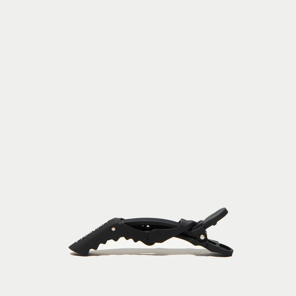 Black hair clip on a white background