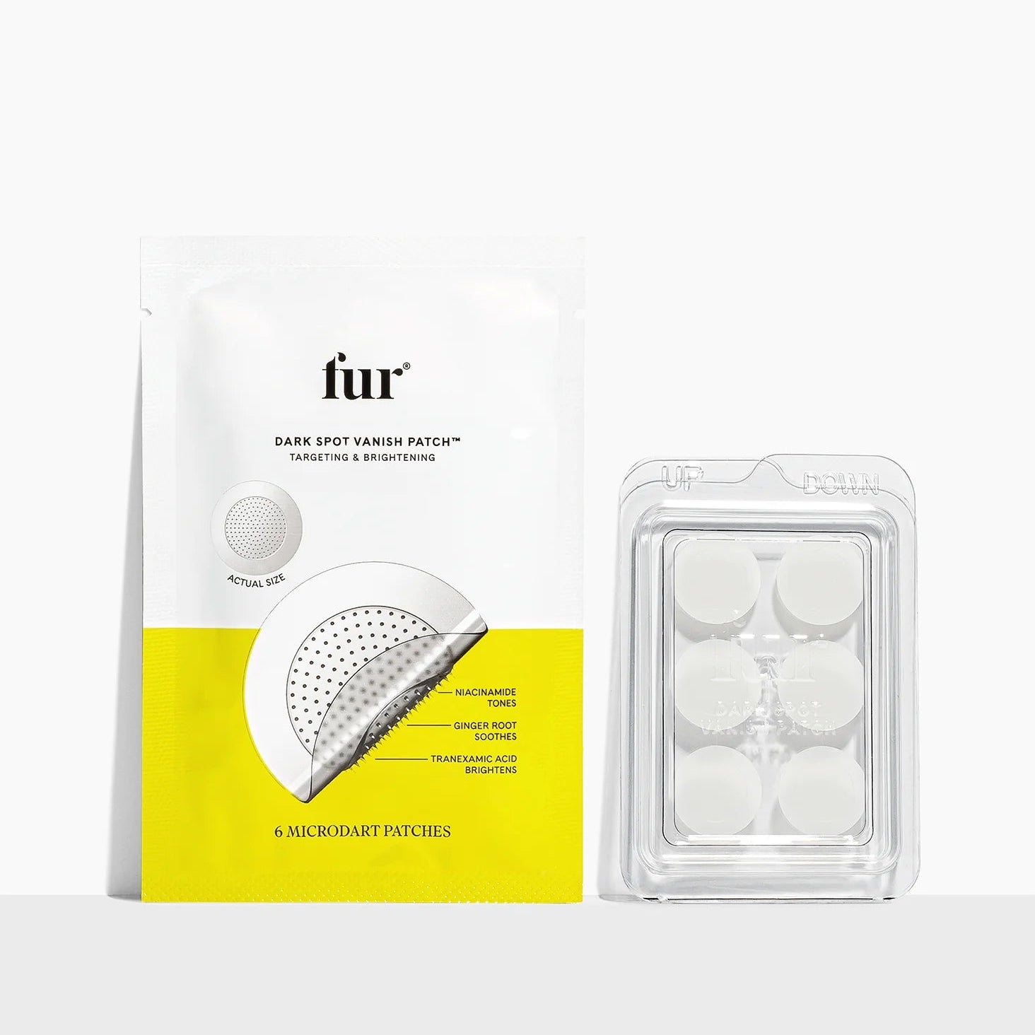 Packaging of fur dark spot corrector patches on a white background