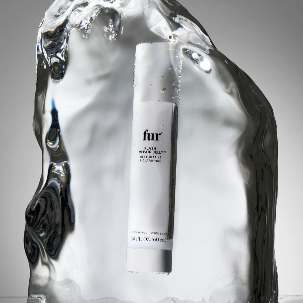 Fur product bottle inside a block of ice on a gray background