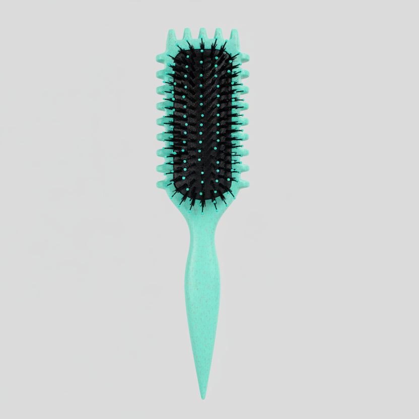 Green curly girl hairbrush with black bristles on a pegboard background