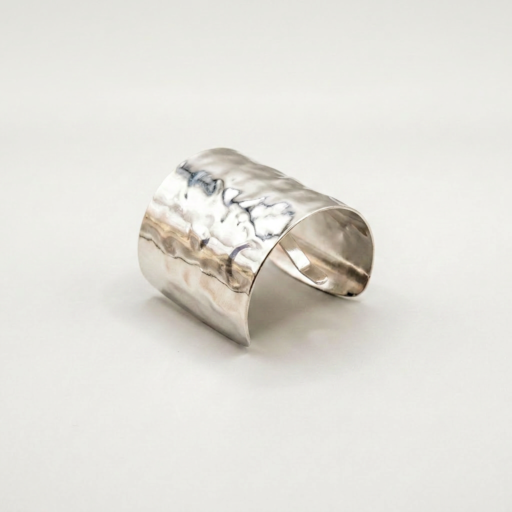 Gildie Silver ponytail cuff on a light gray background