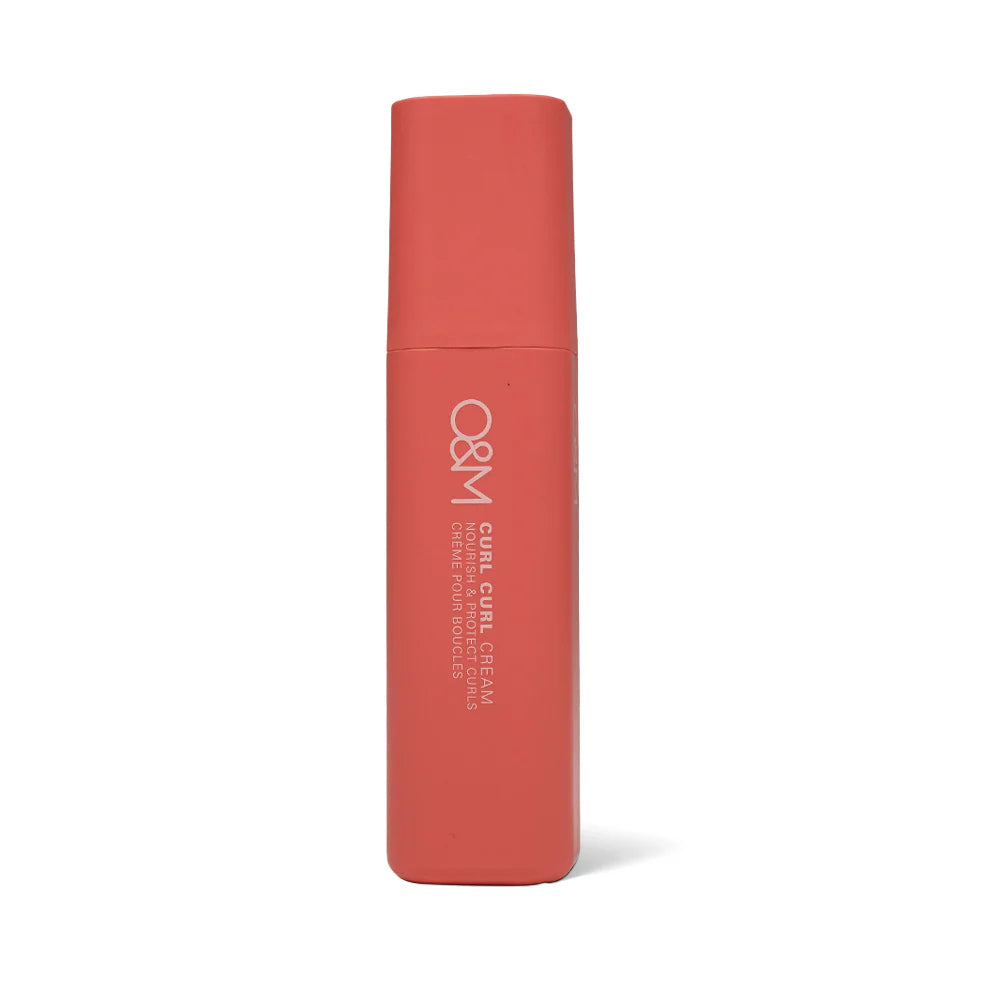 Red cylindrical container with 'O&M Curl Curl Cream' branding on a white background
