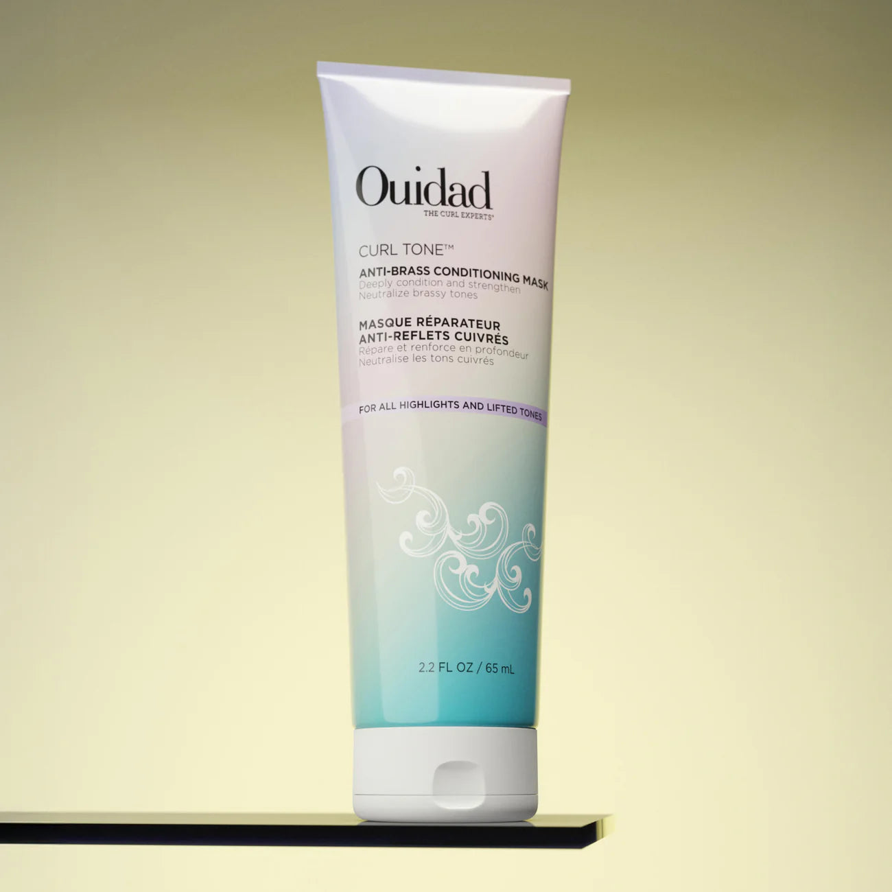 Ouidad Curl Tone Anti-Brass Conditioning Mask on a beige background