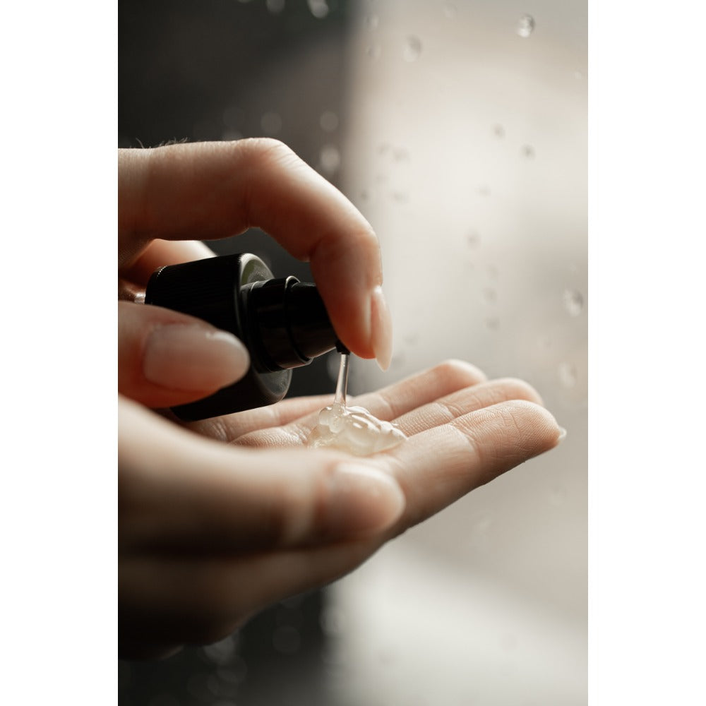 Oway Smoothing Fluid sprayed into hand