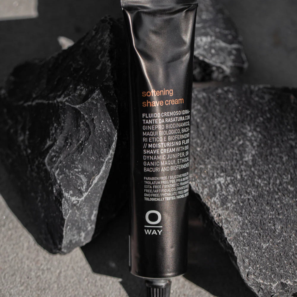 Tube of Oway softening shave cream on a stone surface