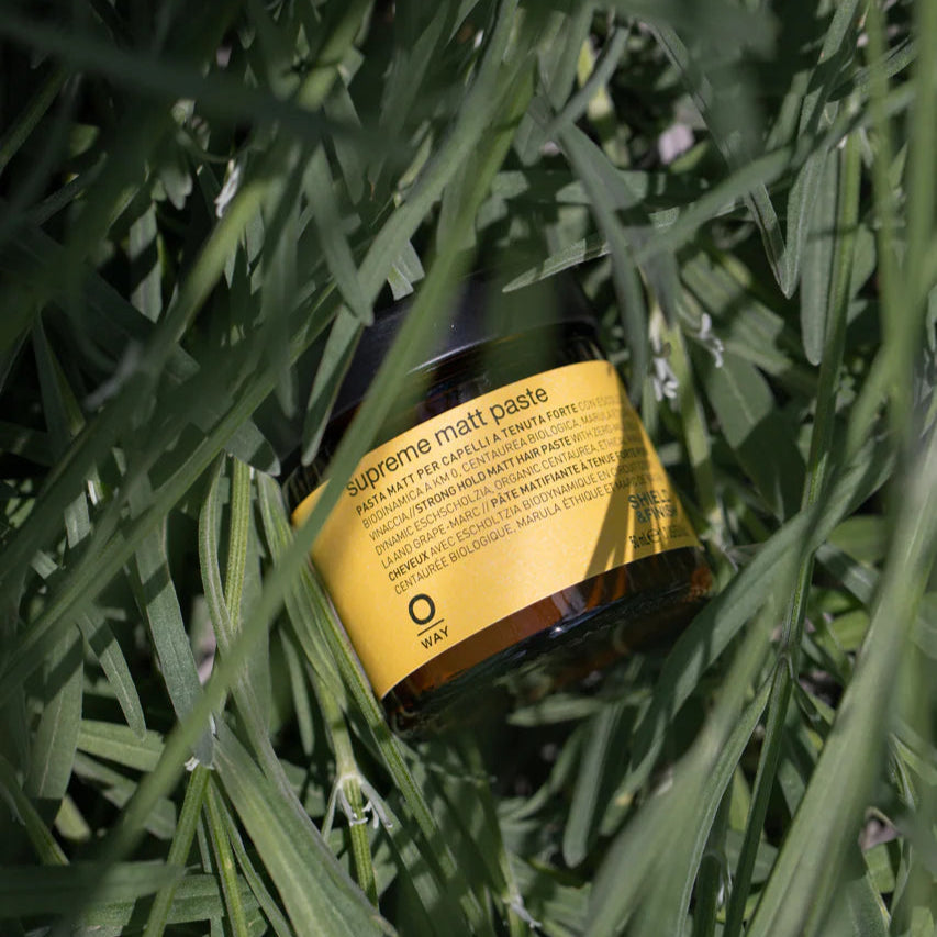 A container of Oway Matt Paste on grass